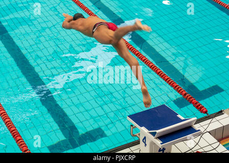 A gay athlete participant diving at swimming pool, Gay Games 2018, paris, france Stock Photo