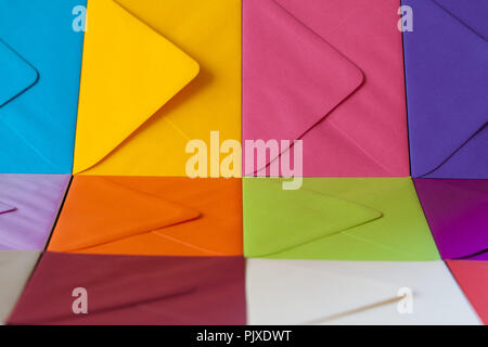 Different colored envelopes on the table. Composition with envelopes on the table. Stock Photo