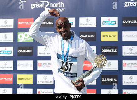 Sir Mo Farah celebrates winning the Men's Elite race during the 2018 Simply Health Great North Run. Stock Photo