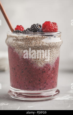 Berry smoothie and chia pudding for breakfast in a glass. Healthy vegan food concept. Stock Photo