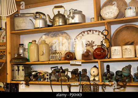 Ireland, Co Leitrim, Ballinamore, Aghoo, Glenview Folk Museum, display of household domestic items with double spout teapot Stock Photo