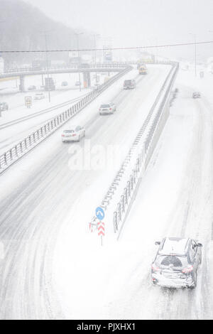 Snow storm on the roads in December in Kiev, Ukraine. Snowy and nothing visibility on the street Stock Photo