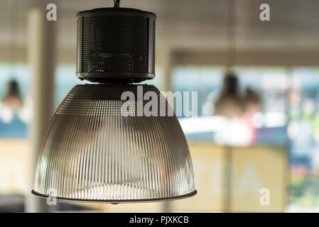 Modern lamp shade on office ceiling close Stock Photo