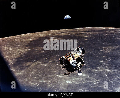 In Lunar Orbit - (FILE) -- With a half-Earth in the background, the Lunar Module (LM) ascent stage with Moon-walking Astronauts Neil Armstrong and Edwin Aldrin Jr. aboard approaches for a rendezvous with the Apollo Command Module manned by Michael Collins on Monday, July 21, 1969. The Apollo 11 liftoff from the Moon came early, ending a 22-hour stay on the Moon by Armstrong and Aldrin. Credit: NASA / CNP /MediaPunch Stock Photo