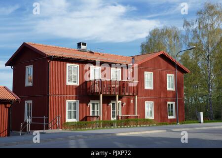 Scandinavian housing, classic red villa with blue sky Stock Photo