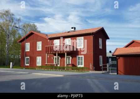 Scandinavian housing, classic red villa with blue sky Stock Photo