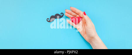 Creative flatlay top view retro black paper photo booth props moustaches woman hands turquoise background copy space. Men health awareness month fathe Stock Photo