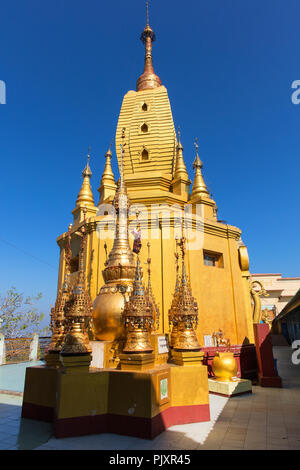 The golden stupa of the buddhist monastery at the top of the pedestal hill of Taung Kalat (Mount Popa), Myanmar (Burma). Stock Photo