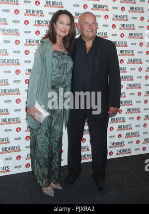 Cast member Christopher Ellison and his wife Anita attending the The Krays: Dead Man Walking film premiere at Genesis Cinema, East London. Stock Photo