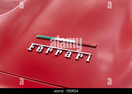 Ferrari car badge and Italian flag Stock Photo