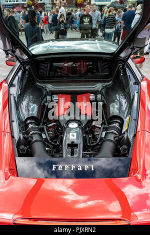 Ferrari engine bay with people in the background Stock Photo