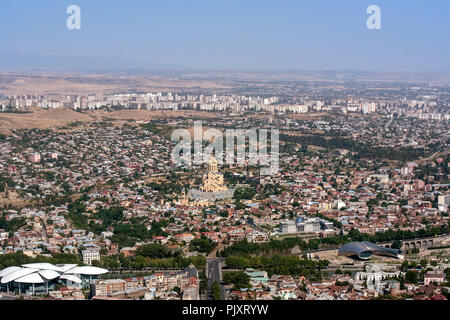 A city scape view of Tbilisi, the capital city of Geogria. Central of the view is Tsminda Sameba Cathedral  or Holy Trinity Cathedral of Tbilisi. Stock Photo