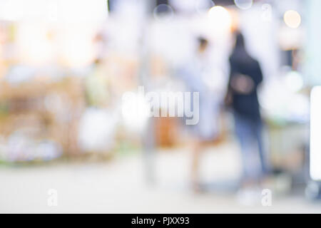 Blurred background crowd of people shopping in event expo trade fair with bokeh light Stock Photo