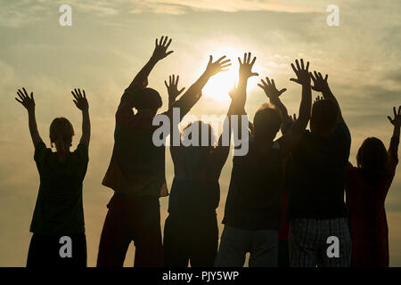 Happy family stretching hands at the morning. Stock Photo