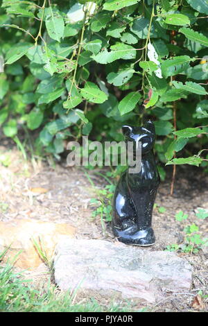 cat statue in outdoor garden Stock Photo