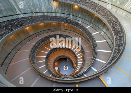 The Bramante Staircase is a double helix, having two staircases allowing people to ascend without meeting people descending Stock Photo