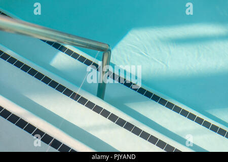 Swimming pool, handrail and stairs Stock Photo