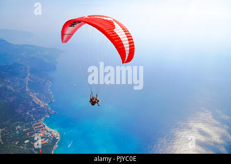 Fethiye, Mugla/Turkey- August 19 2018: Tandem paragliders on Mediterranean Sea. Stock Photo