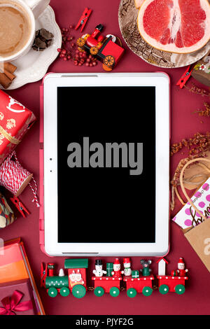 New Year's decor and gifts for the new year and Christmas. Morning fragrant coffee and rose petals. Top view. Different subjects on a red background. Copy space, flat lay, Stock Photo
