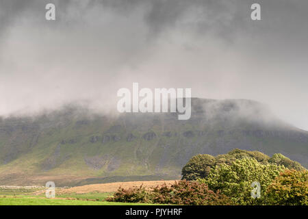 Yorkshire, UK. 9th September 2018: Drama in the storm clouds over Ribblehead Viaduct as Train crossing the dales, sheep hold up traffic along the B roads around the dales.  Clifford Norton Alamy Live News. Credit: Clifford Norton/Alamy Live News Stock Photo