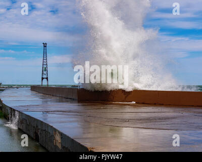 Chicago, Illinois, USA. 9th September 2018. A wave explodes over the breakwall at Montrose Point. High winds blowing along the full fetch of 300 mile/480 kilometer long Lake Michigan raised waves as high as 10 feet/3 meters. Credit: Todd Bannor/Alamy Live News Stock Photo