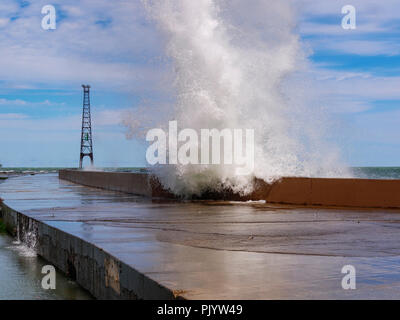 Chicago, Illinois, USA. 9th September 2018. A wave explodes over the breakwall at Montrose Point. High winds blowing along the full fetch of 300 mile/480 kilometer long Lake Michigan raised waves as high as 10 feet/3 meters. Credit: Todd Bannor/Alamy Live News Stock Photo