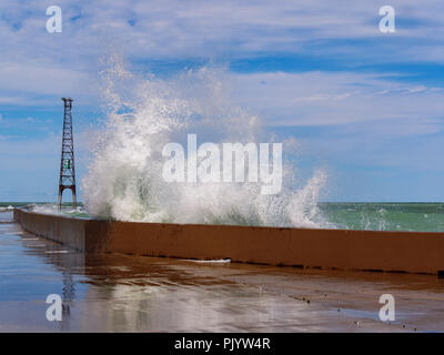 Chicago, Illinois, USA. 9th September 2018. A wave explodes over the breakwall at Montrose Point. High winds blowing along the full fetch of 300 mile/480 kilometer long Lake Michigan raised waves as high as 10 feet/3 meters. Credit: Todd Bannor/Alamy Live News Stock Photo