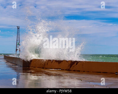 Chicago, Illinois, USA. 9th September 2018. A wave explodes over the breakwall at Montrose Point. High winds blowing along the full fetch of 300 mile/480 kilometer long Lake Michigan raised waves as high as 10 feet/3 meters. Credit: Todd Bannor/Alamy Live News Stock Photo