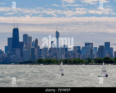 Chicago, Illinois, USA. 9th September 2018. Two intrepid sailors piloting laser class sailing dinghies brave rough Lake Michigan. High winds blowing along the full fetch of the 300 mile/480 kilometer long lake raised waves as high as 10 feet/3 meters. Credit: Todd Bannor/Alamy Live News Stock Photo