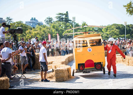 Lisbon, Portugal. 9th Sep, 2018. A participant seen pushing his car by hand after an accident who damaged it at the 3rd Grand Prix Red Bull in Lisbon known as ''The Crazy Race in the World''.''The Crazy Race in the World'' is an event for amateur riders racing on handmade cars. The vehicles move by creativity and friendly competition, without ever forgetting the speed adrenaline. This race of vehicles without motor, proposes to the participants the construction of a car that defies the norms of the design and the laws of the physics. They will compete against the clock on a sloping cour Stock Photo
