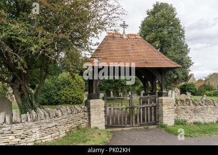 Lych gate at the entrance to the parish church of All Saints in the Bedfordshire village of Milton Ernest, UK Stock Photo