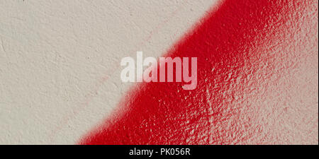 Colorful wall background. White painted wall with red graffiti fragment Stock Photo