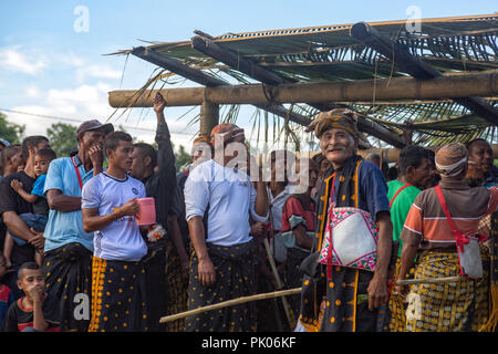 BAJAWA, INDONESIA - MAY 19: Unidentified crowd with traditional sarongs gather near  Bajawa in East Nusa Tenggara, Indonesia on May 19, 2017. Stock Photo