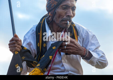 BAJAWA, INDONESIA - MAY 19: Unidentified Flores man dances at a traditional boxing match near  Bajawa in East Nusa Tenggara, Indonesia on May 19, 2017 Stock Photo