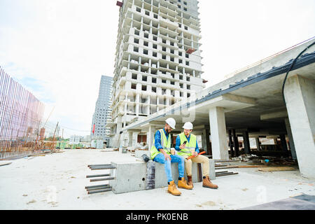 Engineers discussing construction project Stock Photo
