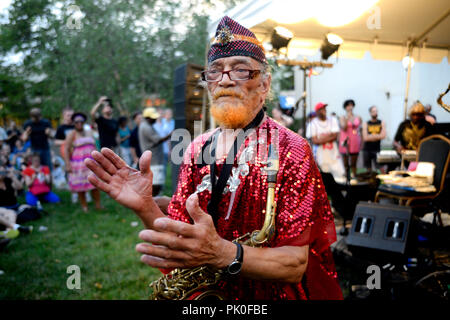 Saxoponist and conductor Marshall Allen leads the improv Jazz troupe Sun Ra Arkestra during a rare hometown appearance at the Summer Concert Series in Stock Photo