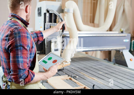 Man operating machine Stock Photo