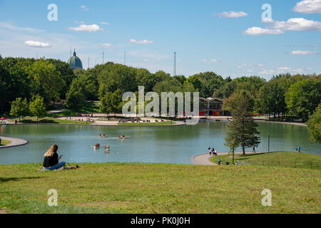 Montreal, Canada - 8 September 2018: People enjoy a warm summer day in the Mont Royal Park near the Beaver Lake Stock Photo