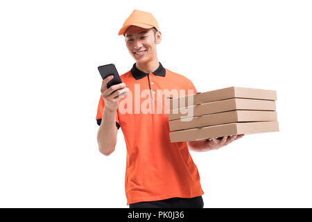 Cheerful pizza delivery person holding a smart phone Stock Photo