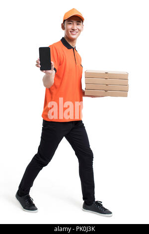 Cheerful pizza delivery person showing a smart phone Stock Photo