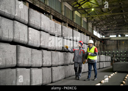 Workers at Industrial Plant Stock Photo