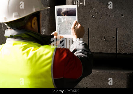 Worker Taking Photo Stock Photo