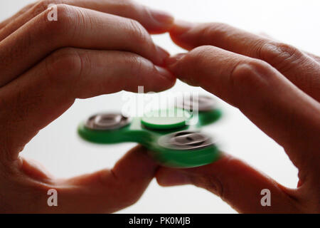 Hand spinner, fidgeting hand toy Stock Photo