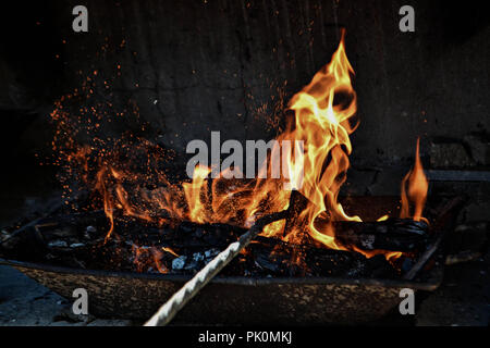 Burning wood in the open fireplace/ The warm mood in open fireplace Stock Photo