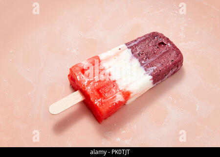 Vanilla berry organic homemade lollipop ice presented on a pink background with copy space for text. Natural healthy food. Top view Stock Photo