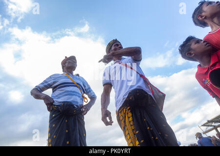 BAJAWA, INDONESIA - MAY 19: Unidentified village elders search the crowd for traditional boxing participants near  Bajawa in East Nusa Tenggara, Indon Stock Photo