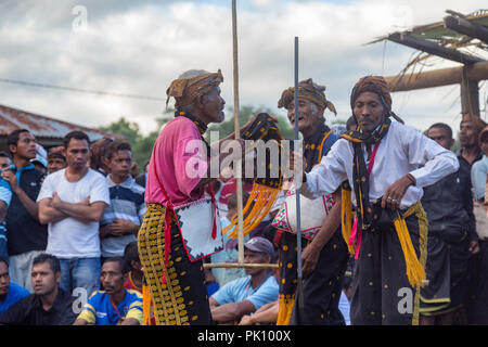 BAJAWA, INDONESIA - MAY 19: Unidentified men dance with traditional garb near  Bajawa in East Nusa Tenggara, Indonesia on May 19, 2017. Stock Photo