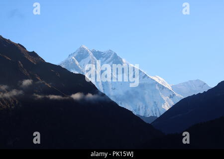 Amazing Shot of Wonderful view of Ama Dablam mountain peak on the way to Everest base camp covered with white snow Stock Photo