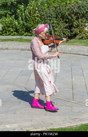Morris dancer musician violin player, member of Guith Morris at the Swanage Folk Festival, Swanage, Dorset UK on a lovely warm sunny day in September Stock Photo