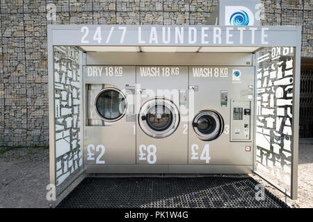 24/7 Launderette washing machines at Pwllheli sailing club on the North Wales coast Stock Photo